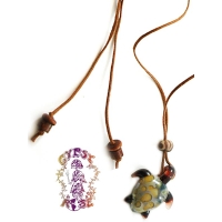 GLASS TURTLE ON CORD NECKLACE